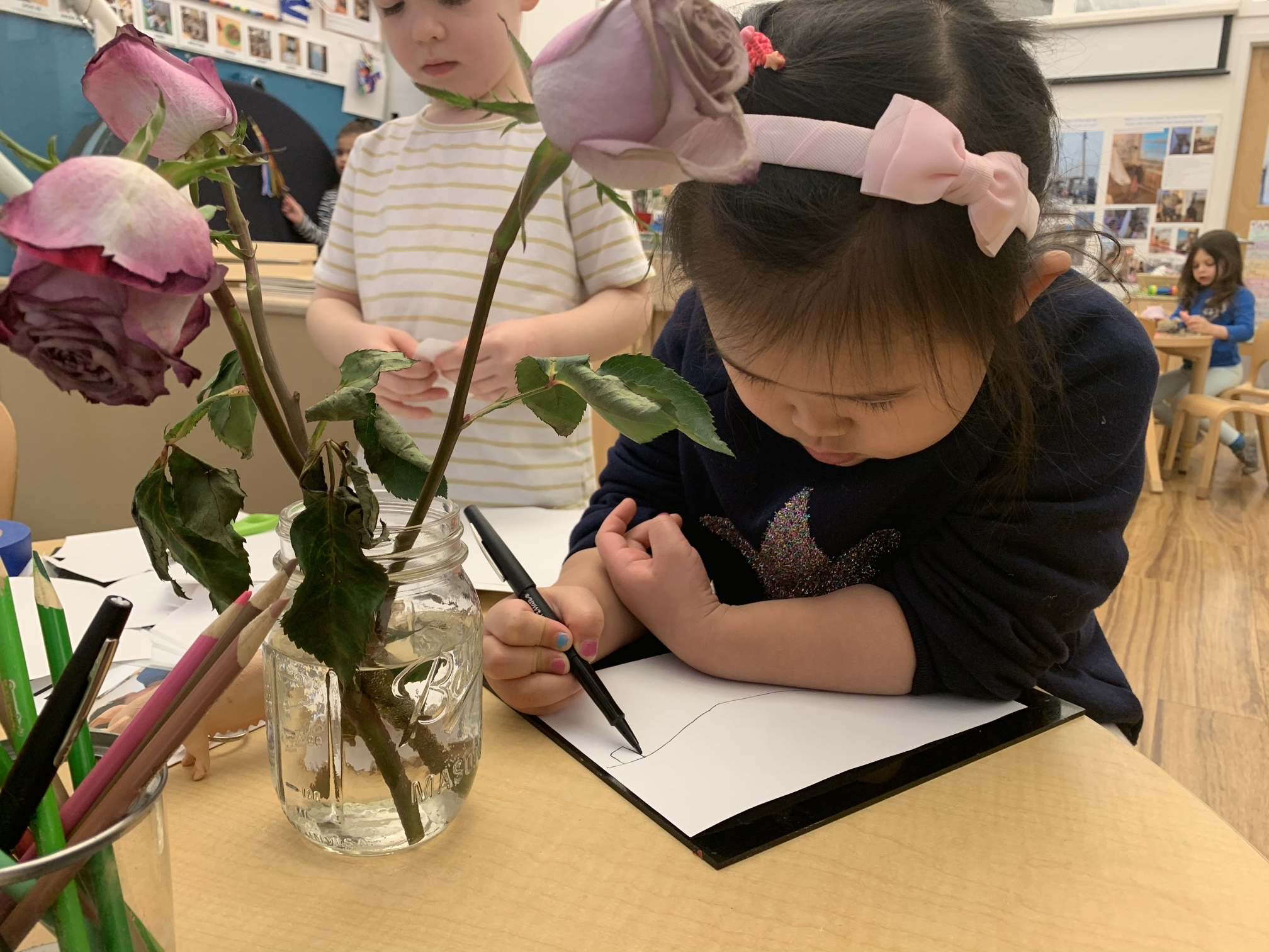 a child drawing a flower